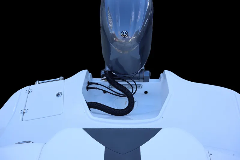 Slide: The Image of 2024 Chaparral 21 SSi Ski & Fish OB boat engine detail, showcasing sleek design. - 12