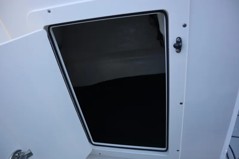 Slide: The Image of Open storage compartment on 2024 Chaparral 21 SSi Ski & Fish OB boat. - 16