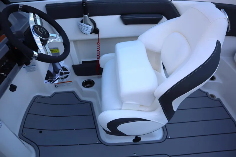 Slide: The Image of 2024 Chaparral 21 SSi Ski & Fish OB cockpit with steering wheel and cushioned seat. - 5