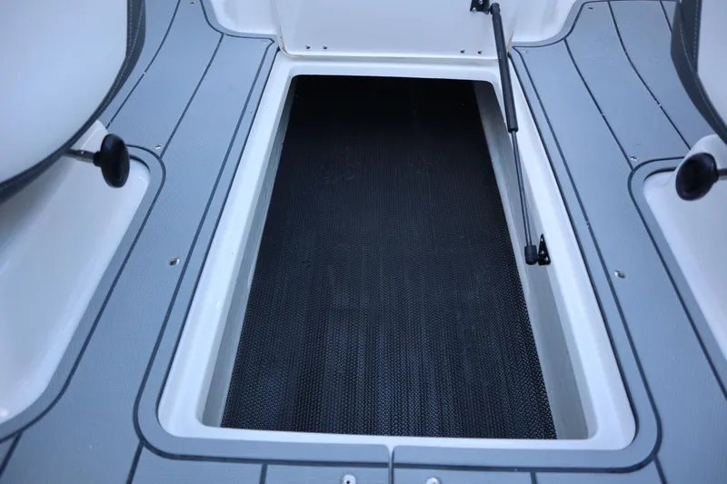Slide: The Image of 2024 Chaparral 21 SSi Ski & Fish OB boat storage compartment, open and empty. - 7