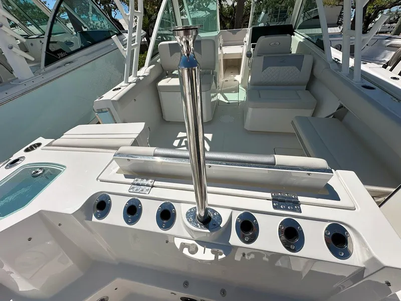 Slide: The Image of 2025 Sailfish 276 DC boat interior with seating and rod holders. - 12