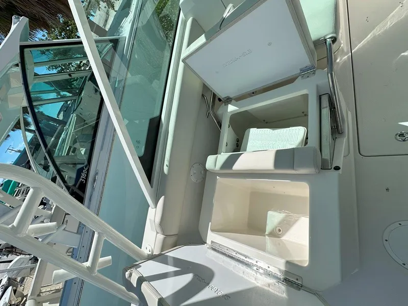 Slide: The Image of 2025 Sailfish 276 DC boat interior with open storage compartments. - 29