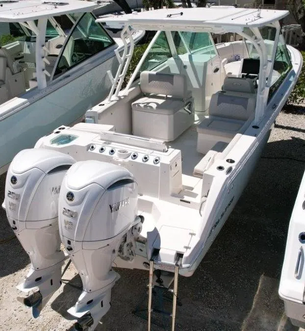 Slide: The Image of 2025 Sailfish 276 DC boat with dual Yamaha engines, docked and ready for adventure. - 3