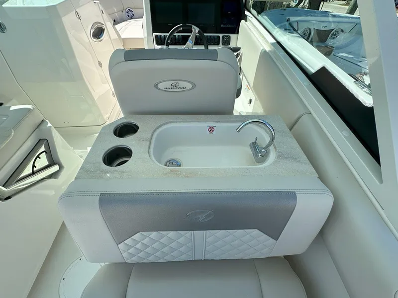 Slide: The Image of 2025 Sailfish 276 DC boat interior with sink and cup holders. - 30