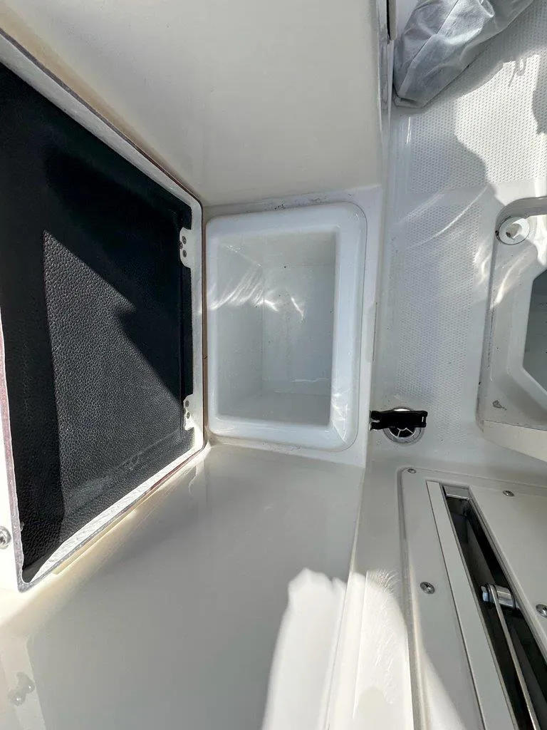 Slide: The Image of Interior compartment of 2025 Sailfish 276 DC boat, featuring storage and sleek design. - 33