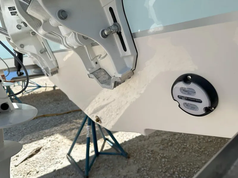 Slide: The Image of Close-up of 2025 Sailfish 276 DC boat hull and fittings on a stand. - 39