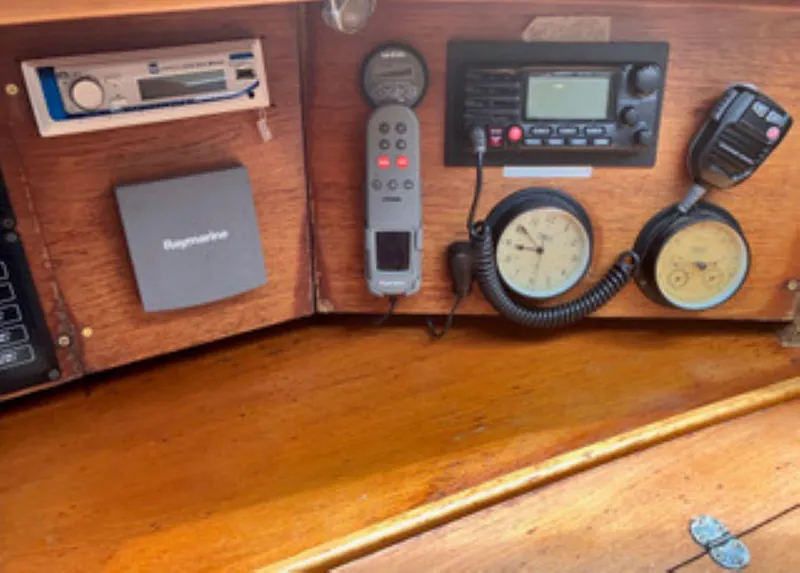 Slide: The Image of Control panel of a 2002 Jeanneau 43DS sailboat with navigation and communication equipment. - 10