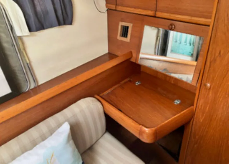 Slide: The Image of Interior of 2002 Jeanneau 43DS yacht with wooden desk and mirror. - 13