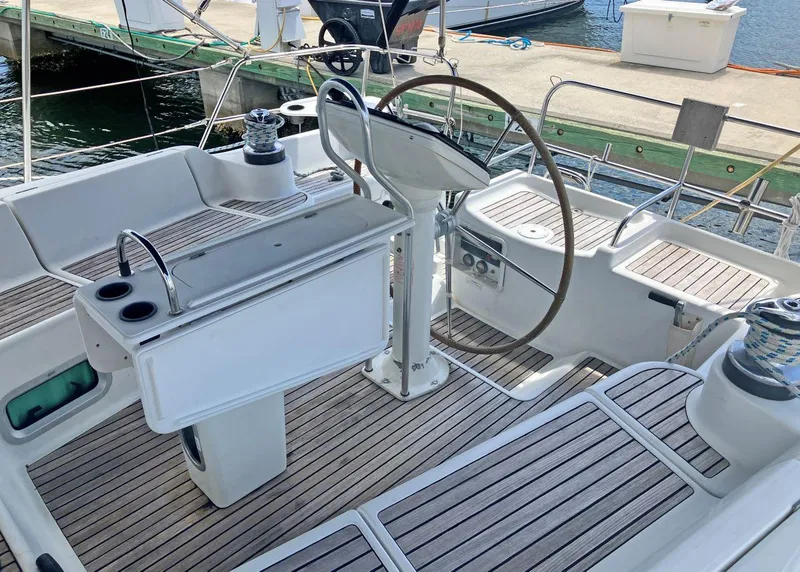 Slide: The Image of Cockpit of 2002 Jeanneau 43DS sailboat with wooden deck and steering wheel. - 3
