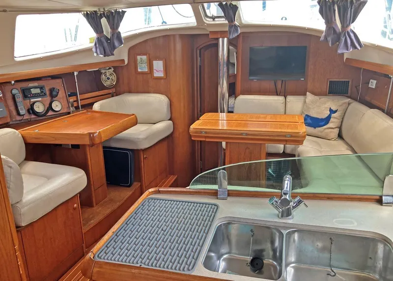 Slide: The Image of Interior of 2002 Jeanneau 43DS yacht with wood finish and modern amenities. - 8