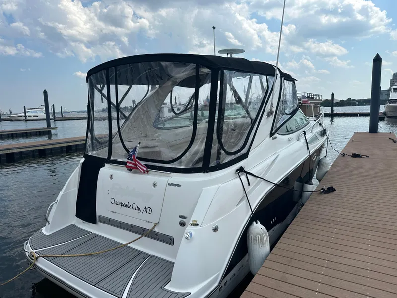 Slide: The Image of 2008 Bayliner 300SB docked at marina, Chesapeake City, MD, under partly cloudy sky. - 2