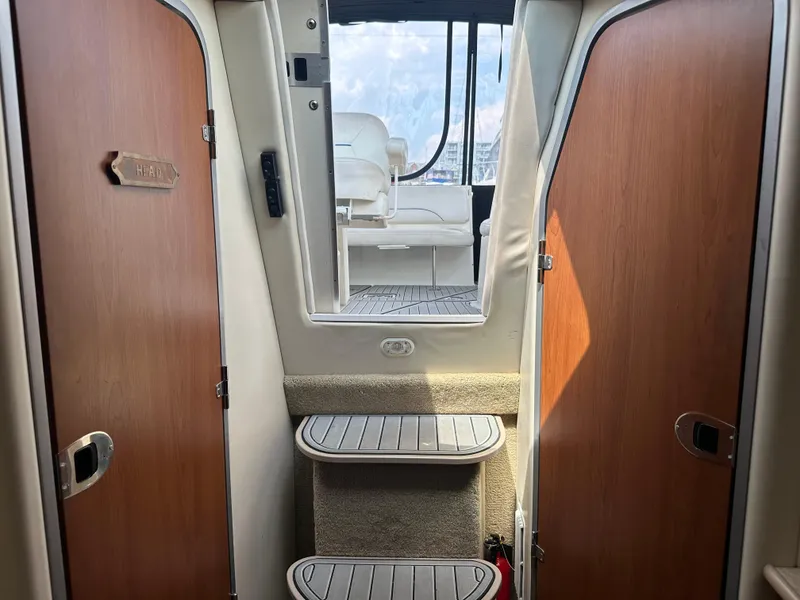 Slide: The Image of Interior view of 2008 Bayliner 300SB boat, showing steps and seating area. - 20