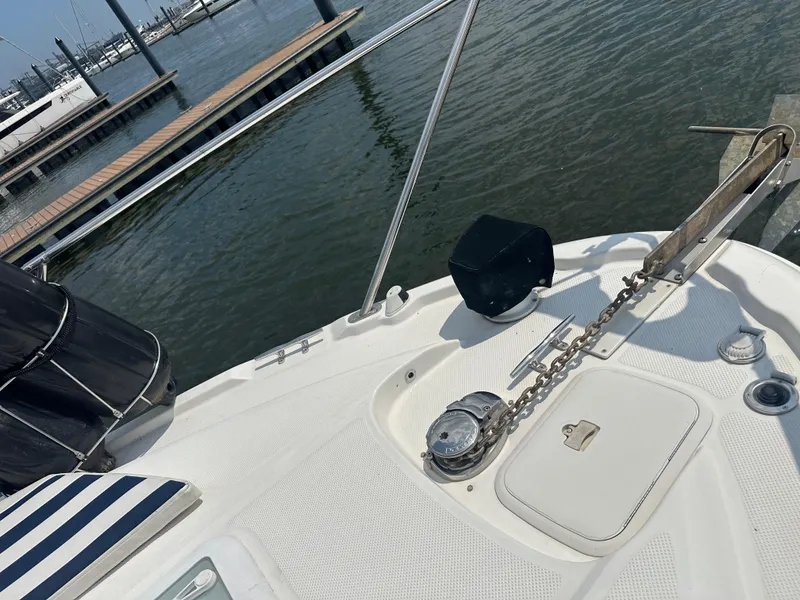 Slide: The Image of 2008 Bayliner 300SB boat deck with anchor chain, docked at marina. - 26