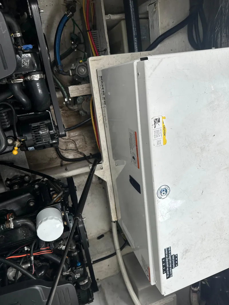 Slide: The Image of Engine compartment of a 2008 Bayliner 300SB boat, showing mechanical components and wiring. - 29