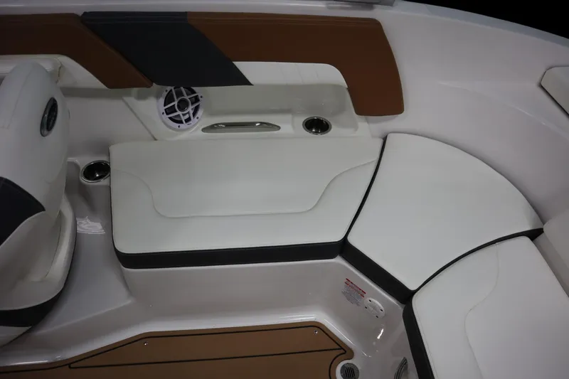 Slide: The Image of 2024 Chaparral 23 SSi boat interior with white seating and speaker system. - 15