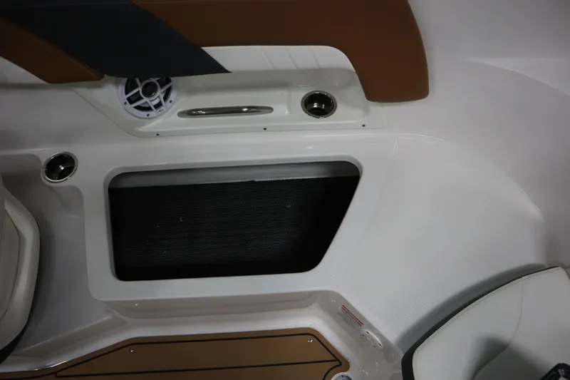 Slide: The Image of 2024 Chaparral 23 SSi boat interior with speaker and storage compartment. - 16