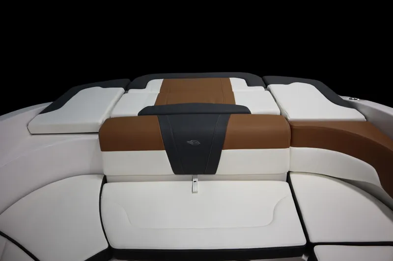 Slide: The Image of 2024 Chaparral 23 SSi boat interior with brown and white cushioned seating. - 19