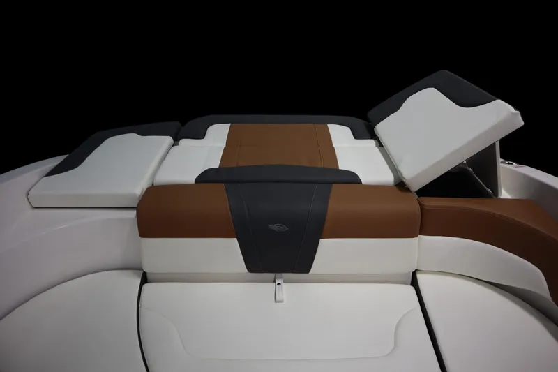 Slide: The Image of 2024 Chaparral 23 SSi boat interior with brown and white cushioned seating. - 20