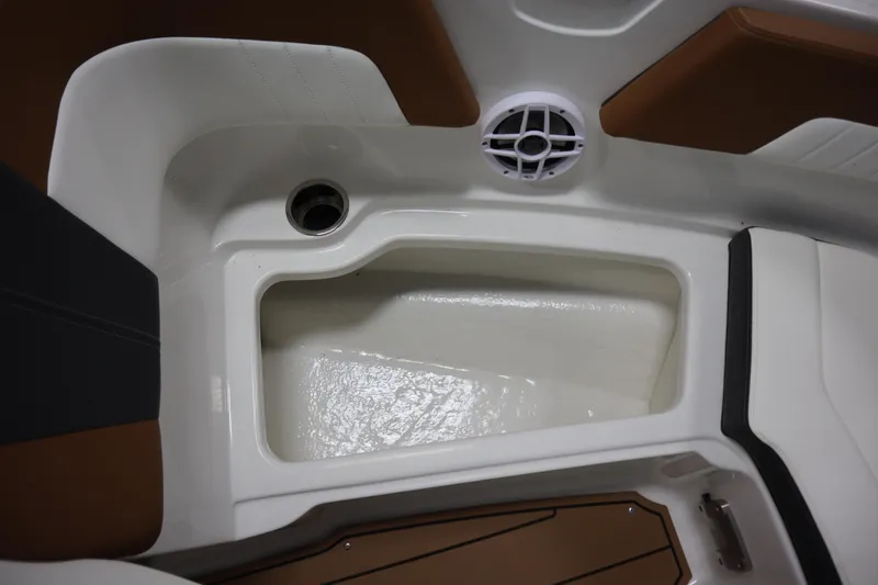 Slide: The Image of 2024 Chaparral 23 SSi boat interior with speaker and storage compartment. - 3