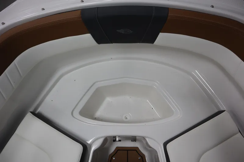 Slide: The Image of 2024 Chaparral 23 SSi boat interior with white and brown seating. - 4