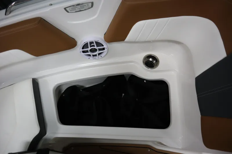 Slide: The Image of 2024 Chaparral 23 SSi boat interior with speaker and storage compartment. - 5