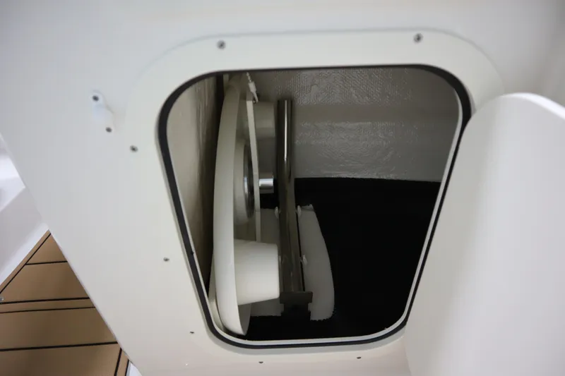 Slide: The Image of Storage compartment inside 2024 Chaparral 23 SSi boat, showcasing interior design and functionality. - 9