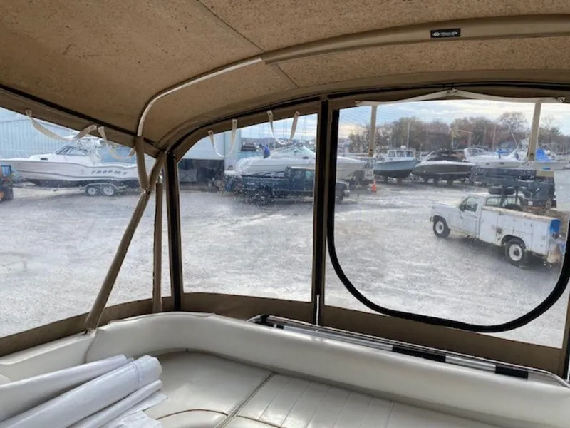 Slide: The Image of View from inside a 1998 Sea Ray Sundancer 370, overlooking a boatyard. - 11