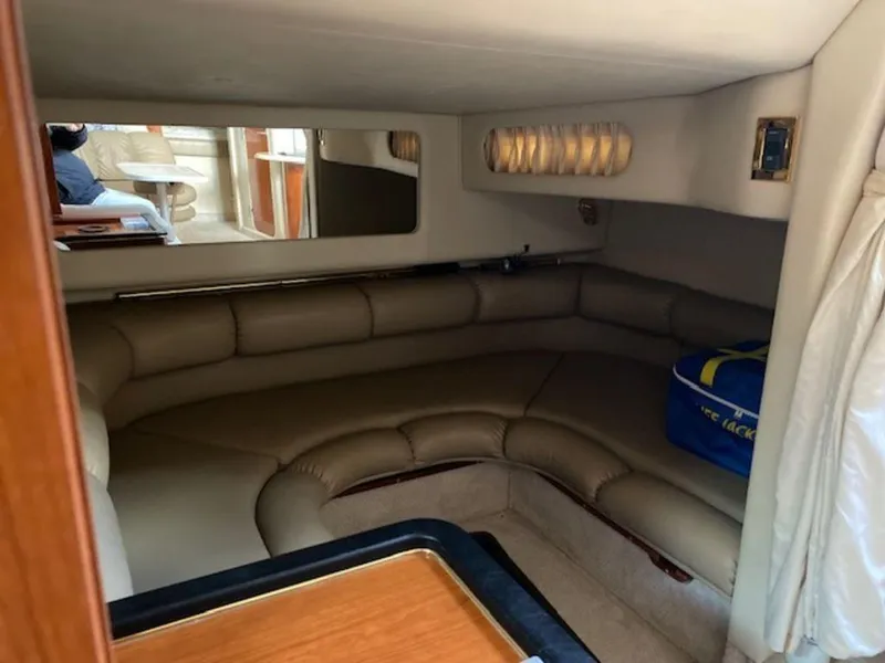 Slide: The Image of Interior of 1998 Sea Ray Sundancer 370 with leather seating and wooden accents. - 18