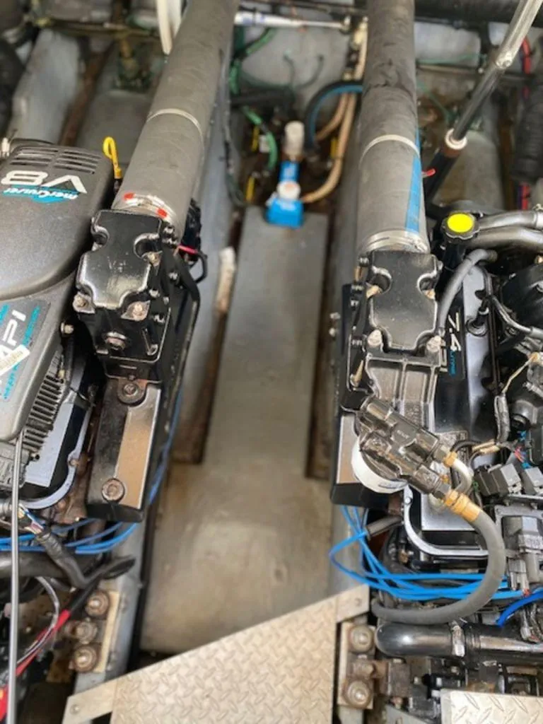 Slide: The Image of Engine compartment of 1998 Sea Ray Sundancer 370 with visible components and wiring. - 22