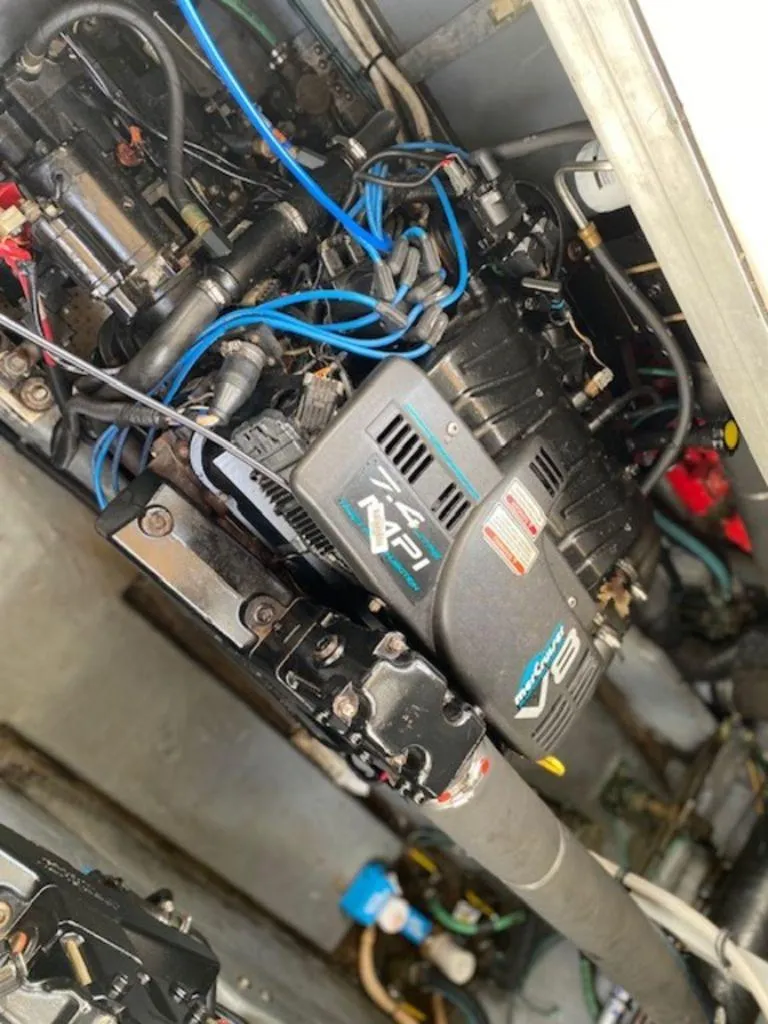 Slide: The Image of Engine compartment of 1998 Sea Ray Sundancer 370 with visible wiring and components. - 23