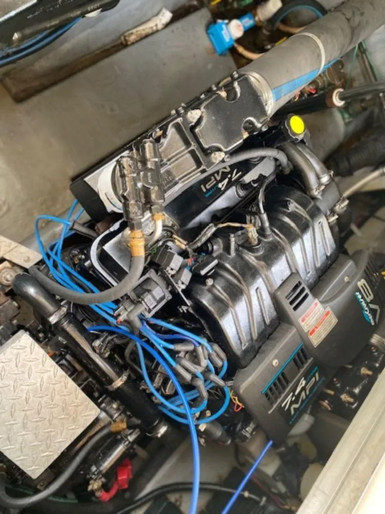 Slide: The Image of Engine of a 1998 Sea Ray Sundancer 370 with visible wiring and components. - 24