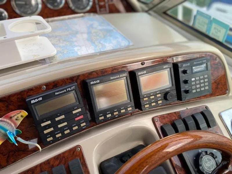 Slide: The Image of Control panel of a 1998 Sea Ray Sundancer 370 with navigation instruments. - 6