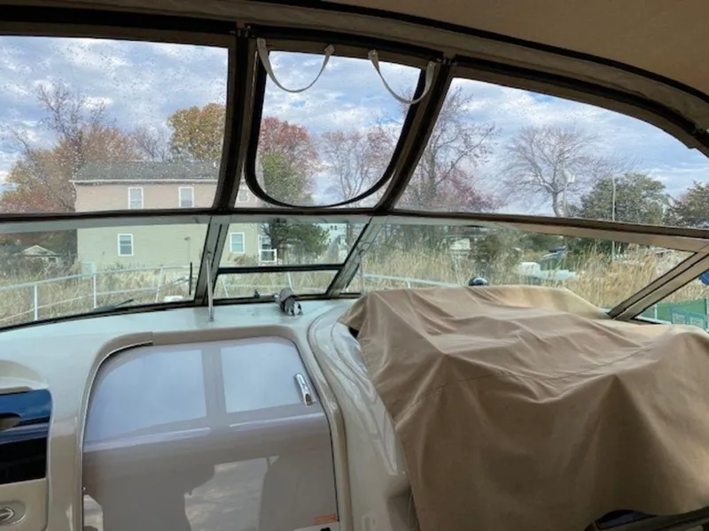 Slide: The Image of Interior view of 1998 Sea Ray Sundancer 370 boat with covered dashboard. - 7