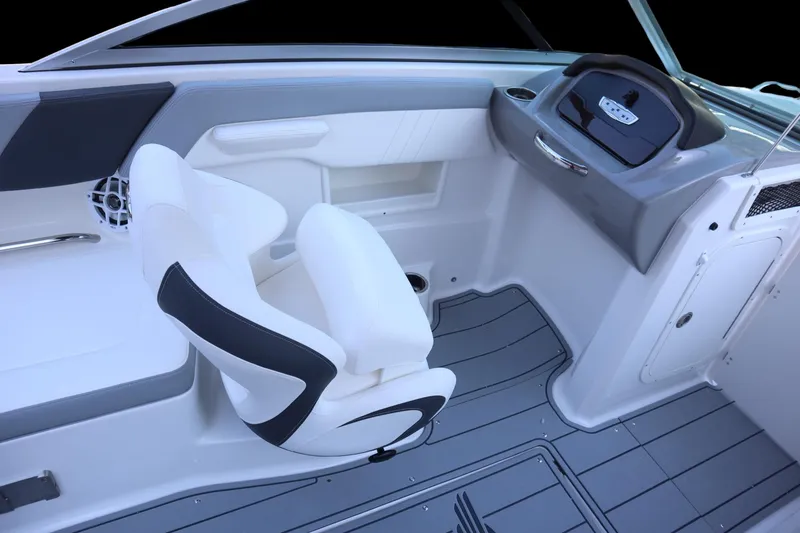 Slide: The Image of 2024 Chaparral 23 SSi OB boat interior with sleek seating and modern dashboard design. - 11