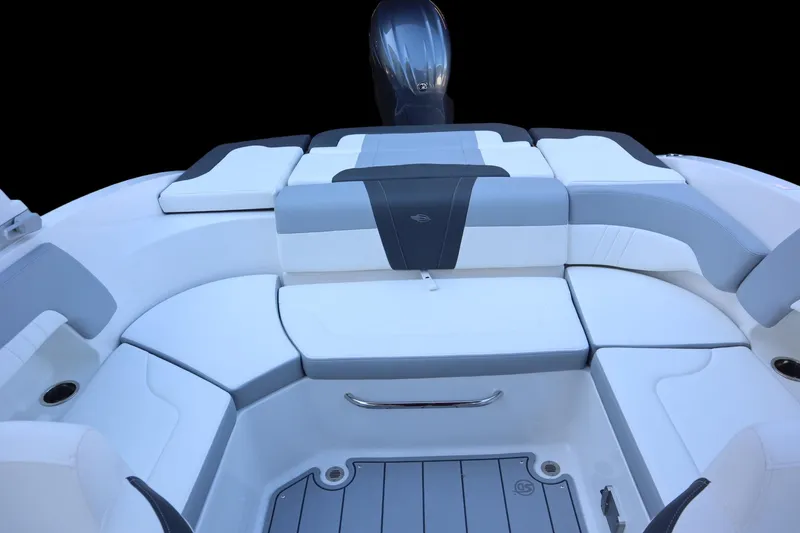 Slide: The Image of 2024 Chaparral 23 SSi OB boat interior with cushioned seating and sleek design. - 12