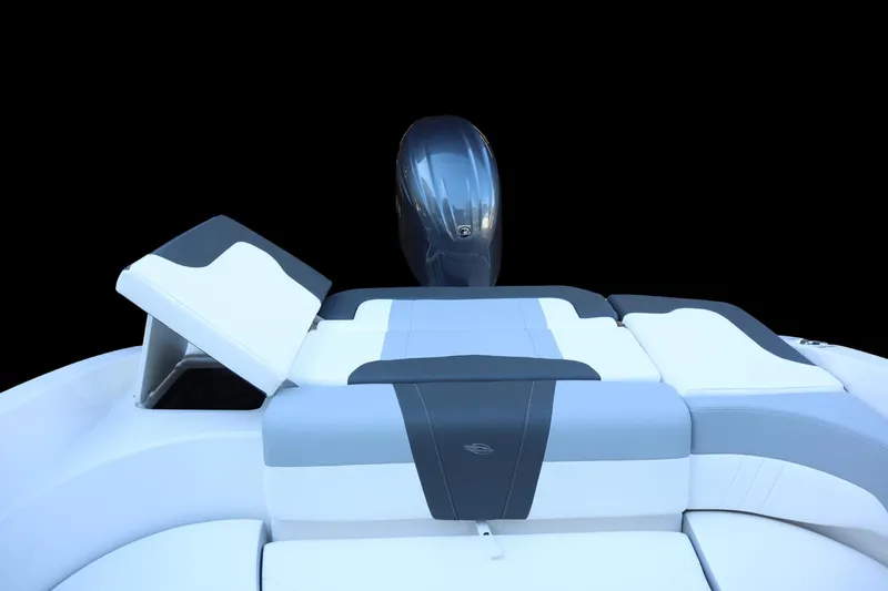 Slide: The Image of 2024 Chaparral 23 SSi OB boat with sleek seating and outboard motor. - 13