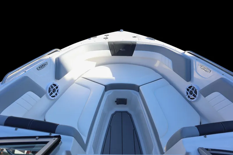 Slide: The Image of 2024 Chaparral 23 SSi OB boat interior with cushioned seating and speakers. - 5