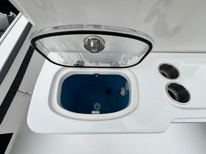Slide: The Image of Livewell on 2026 Tidewater 2700 Carolina Bay boat with cup holders. - 11