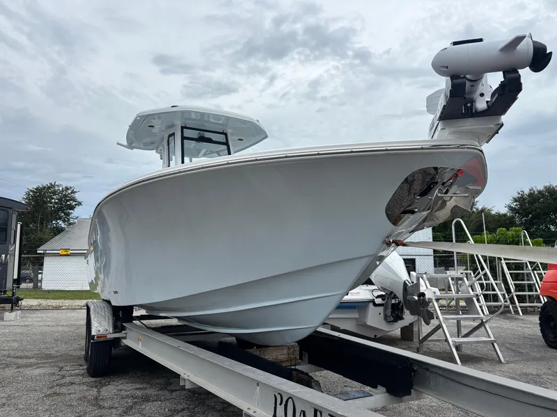 Slide: The Image of 2026 Tidewater 2700 Carolina Bay boat on trailer, viewed from the front. - 2