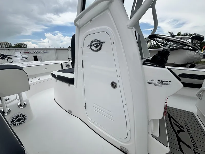 Slide: The Image of 2026 Tidewater 2700 Carolina Bay boat interior with sleek white design and modern features. - 20