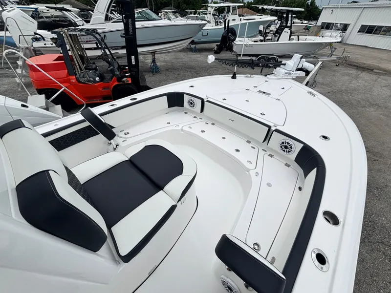 Slide: The Image of 2026 Tidewater 2700 Carolina Bay boat interior with seating and storage compartments. - 22