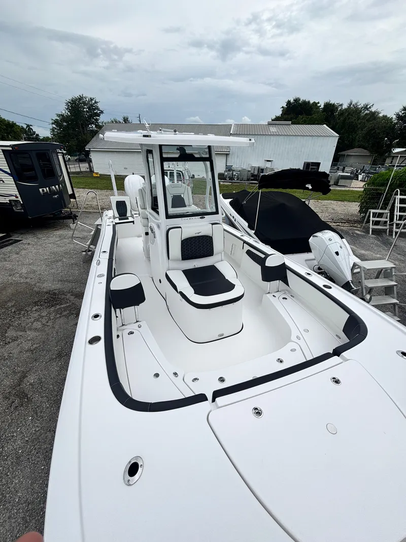 Slide: The Image of 2026 Tidewater 2700 Carolina Bay boat with sleek white design and spacious deck. - 23