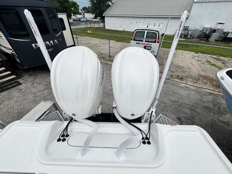 Slide: The Image of 2026 Tidewater 2700 Carolina Bay boat with dual outboard motors and Power-Pole anchors. - 7