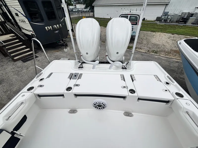 Slide: The Image of 2026 Tidewater 2700 Carolina Bay boat with dual engines and spacious deck layout. - 8