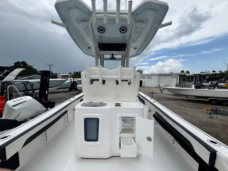 Slide: The Image of 2026 Tidewater 2700 Carolina Bay boat interior with storage compartments and rod holders. - 9