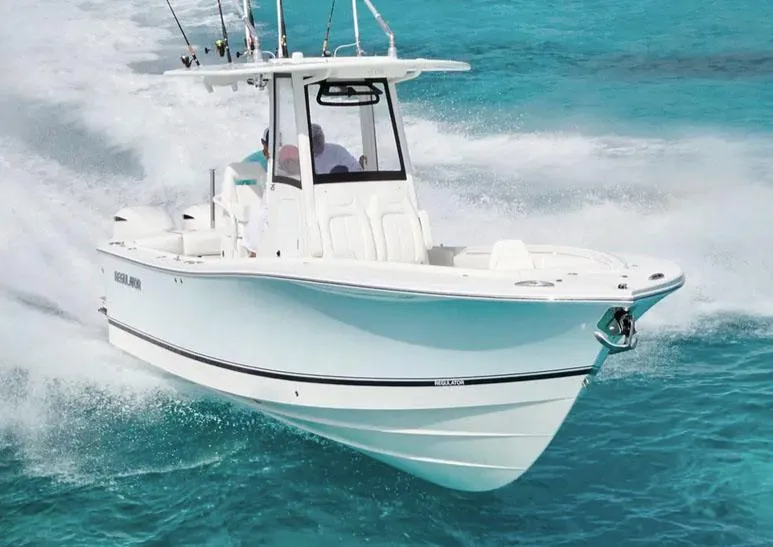 Slide: The Image of 2026 Regulator 25 boat for sale, displayed outdoors under a clear blue sky. - 0