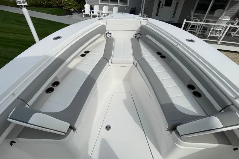 Slide: The Image of 2026 Regulator 25 boat interior with sleek seating and cup holders. - 11