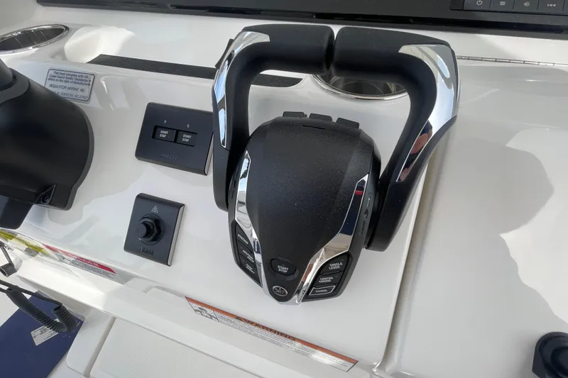 Slide: The Image of Control panel of 2026 Regulator 25 boat with Yamaha throttle and switches. - 14