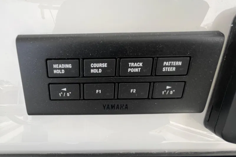 Slide: The Image of Yamaha control panel on 2026 Regulator 25 boat with navigation buttons. - 15
