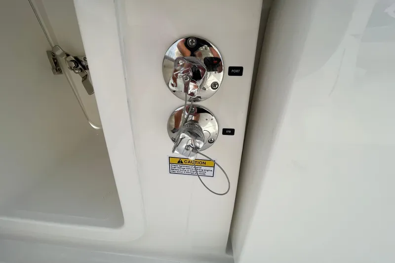 Slide: The Image of Fuel inlets on 2026 Regulator 25 boat, labeled port and starboard, with caution sign. - 27